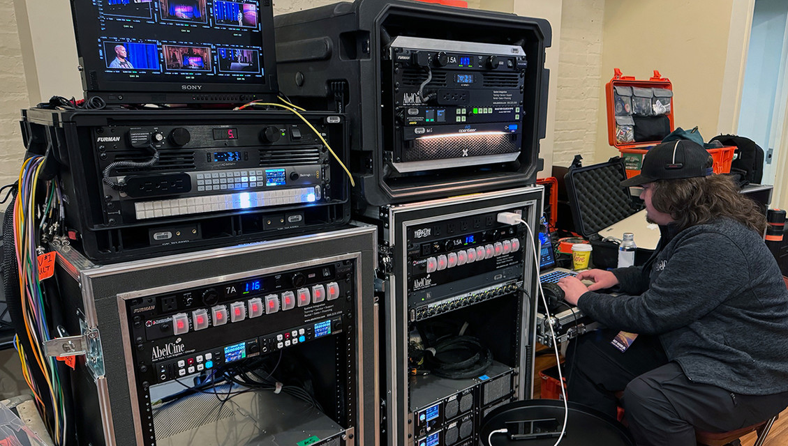 Engineer operating flypacks for live-to-tape project