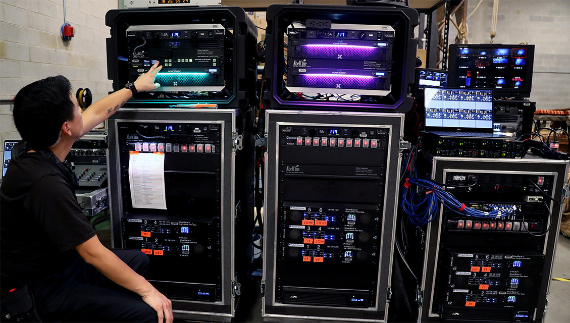 Engineer operating flypacks for live broadcast